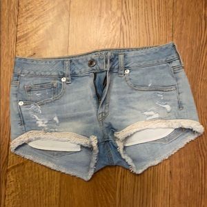 Denim mini shorts with lace accent